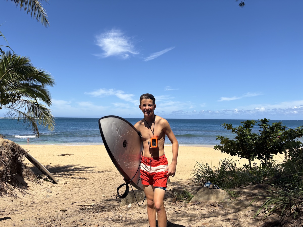 Kade with surfboard